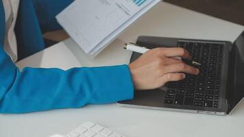 Business woman using calculator for do math finance on wooden desk in office and business working background, tax, accounting, statistics and analytic research concept video