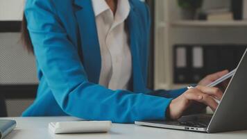 Business woman using calculator for do math finance on wooden desk in office and business working background, tax, accounting, statistics and analytic research concept video