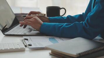 Business woman using calculator for do math finance on wooden desk in office and business working background, tax, accounting, statistics and analytic research concept video