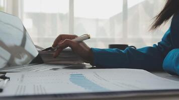 Business woman using calculator for do math finance on wooden desk in office and business working background, tax, accounting, statistics and analytic research concept video