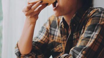 Happy woman eating slice of pizza at sidewalk cafe video