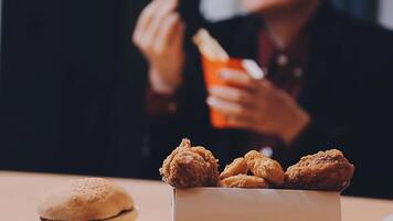 A woman eats with great pleasure, a woman eats a burger, food video