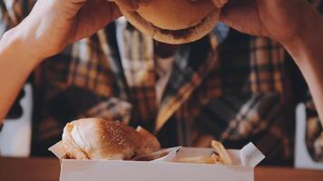 Man is eating in a restaurant and enjoying delicious food video