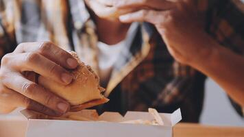 Man is eating in a restaurant and enjoying delicious food video