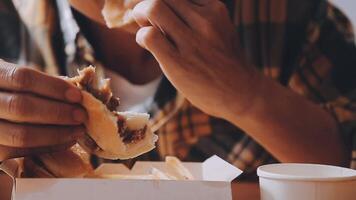 Man is eating in a restaurant and enjoying delicious food video