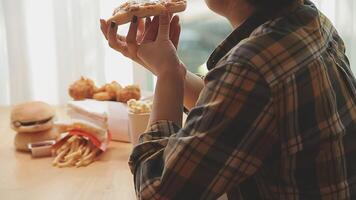 Happy woman eating slice of pizza at sidewalk cafe video