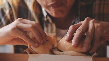 Man is eating in a restaurant and enjoying delicious food video