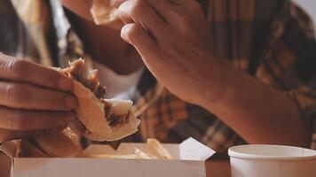 Man is eating in a restaurant and enjoying delicious food video