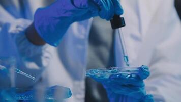 Female Research Scientist Uses Micropipette Filling Test Tubes. Scientist Works in a Team of Scientists Trying to Cure Deadly Disease, They Work in a Big Laboratory Research Center. video