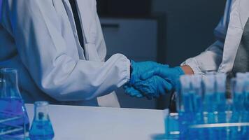 Female Research Scientist Uses Micropipette Filling Test Tubes. Scientist Works in a Team of Scientists Trying to Cure Deadly Disease, They Work in a Big Laboratory Research Center. video