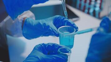 Female Research Scientist Uses Micropipette Filling Test Tubes. Scientist Works in a Team of Scientists Trying to Cure Deadly Disease, They Work in a Big Laboratory Research Center. video