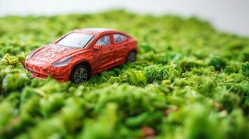 ai generado rojo eléctrico coche en verde musgo promoviendo ambiental proteccion foto