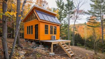 ai generado sostenible fuera de la red cabina en otoñal bosque con solar paneles foto