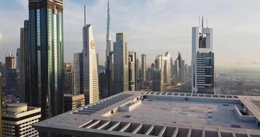 A young man walks on the roof of a skyscraper with a helipad video