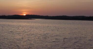 Quiet lake in calm weather during sunset video