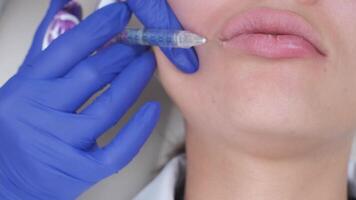 Closeup of botox lip injection using syringe video