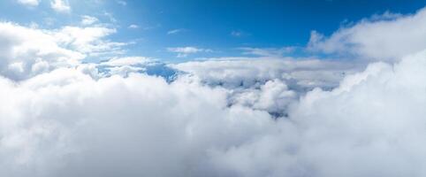 Aerial View of Peaks Shrouded in Clouds Near Verbier, Switzerland photo