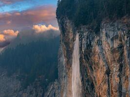 Beautiful aerial view of the Staubbach Falls in Switzerland. Magical panoramic aerial view. photo