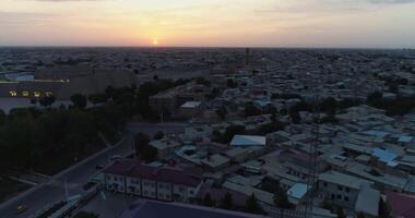 The drone flies over the houses of old Bukhara, Uzbekistan. Early cloudy morning. video