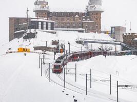 Winter Train Journey to Zermatt Resort Amidst Snowy Landscape, Switzerland photo