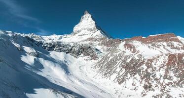 Aerial View of Snow Covered Matterhorn, Zermatt, Switzerland in Midday Light photo