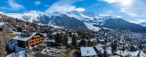 Aerial Panorama of Verbier, Switzerland  Alpine Village and Snowy Mountains photo