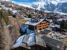 Winter in Verbier, Switzerland  Aerial View of Snowy Chalet Village photo