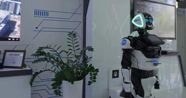 Humanoid robot at the exhibition in the showroom video