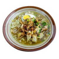 Soto ayam Lamongan isolated on white. Chicken soup. Indonesian popular food photo