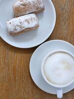 Coffee and cake. Cup with coffee and cupcake. Sweet pastries. Tasty breakfast photo