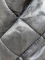 Raincoat fabric. Stitched raincoat fabric. Background with raincoat fabric photo