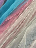 Thin cloth. Thin translucent colored fabric. Fabric background photo