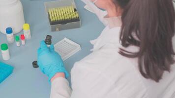 Work on samples of substances is carried out in the laboratory video