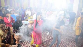 Delhi, India, October 02,2023 - Devotees performing spiritual dance in front of Durga Idol, Durga Puja celebration at Kali Bari temple in Jhilmil Colony Delhi, Durga utsav festival in Oct 2023 video