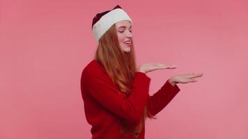 Adult happy cute girl in Christmas sweater listening music, dancing disco fooling around having fun video