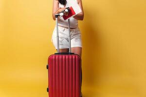 Unrecognizable woman holding a suitcase travel. photo