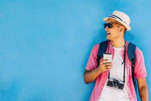 traveler latin american man using a mobile. photo