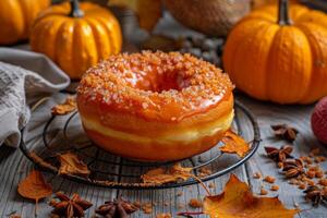 AI generated Pumpkin spice donut with autumn leaves, orange glaze, and sweet dessert appeal photo