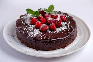 AI generated Chocolate cake dessert with flourless texture topped with raspberries and ganache glaze on a white plate photo