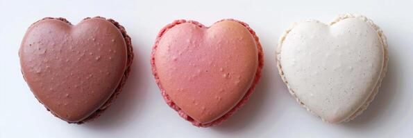 AI generated Three heart-shaped macarons in pastel colors depict love and sweetness on a minimalist background photo