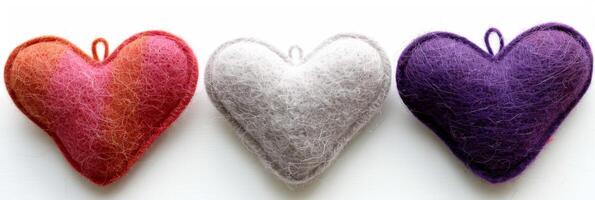 AI generated Three hearts made out of red, white, and purple felt symbolize love and Valentine's decoration photo