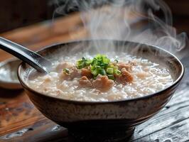 AI generated Aromatic chicken congee topped with spring onions, captured in a rustic bowl with steam rising. Generative AI. photo