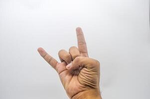metal hand gesture isolated on white background photo