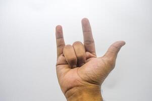 metal hand gesture isolated on white background photo