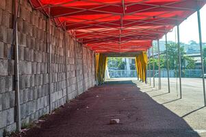 folding tents for bazaars lined up for bazaar preparation, Indonesia, 17 July 2023. photo