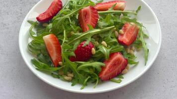 Vitamin salad of strawberry with arugula video