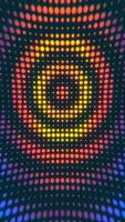 Vertical video - rippling halftone dots pattern with radiating ripples of colorful circles. Full HD and looping abstract background animation.