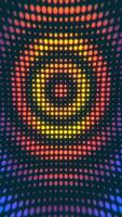 Vertical video - rippling halftone dots pattern with radiating ripples of colorful circles. Full HD and looping abstract background animation.