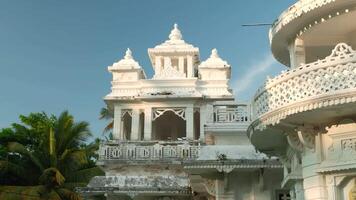 Beautiful white temple with carved elements. Action. Concept of religion and architecture. video