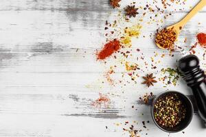 Top view of various spices in bowls isolated on white background. Copy space. photo